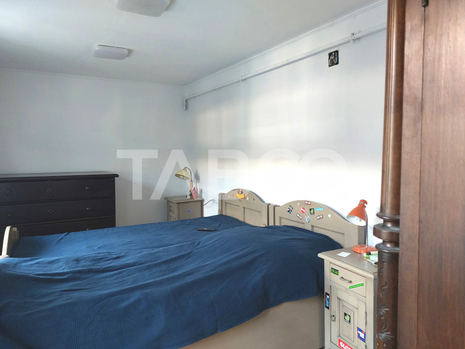 Apartament de vanzare 105 mp 3 camere curte 340 mp in acte Cisnadie