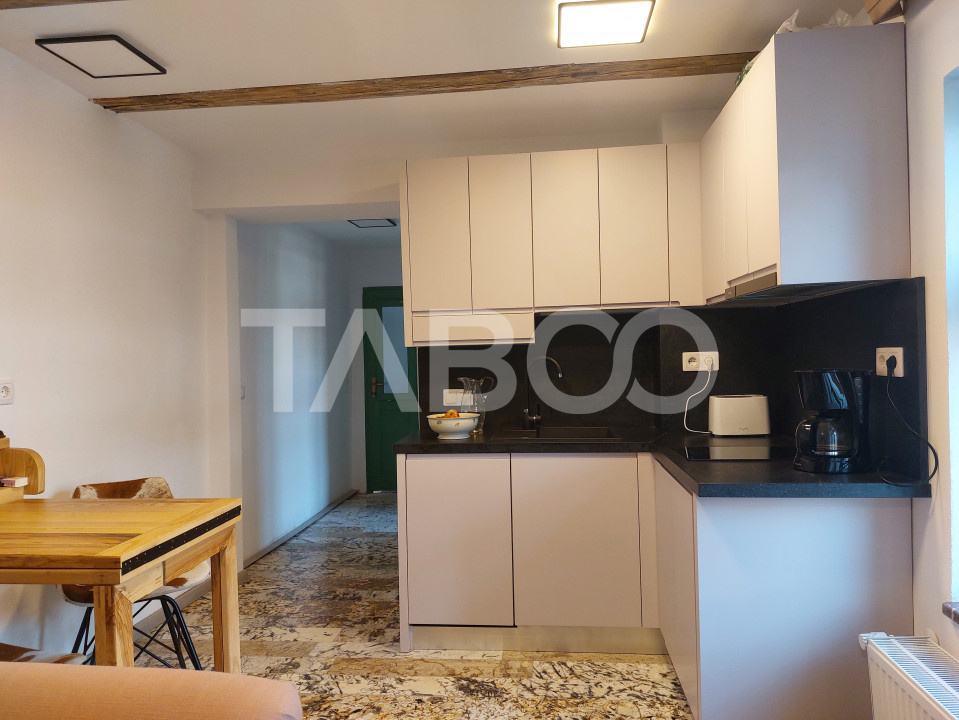Apartament de vanzare 105 mp 3 camere curte 340 mp in acte Cisnadie