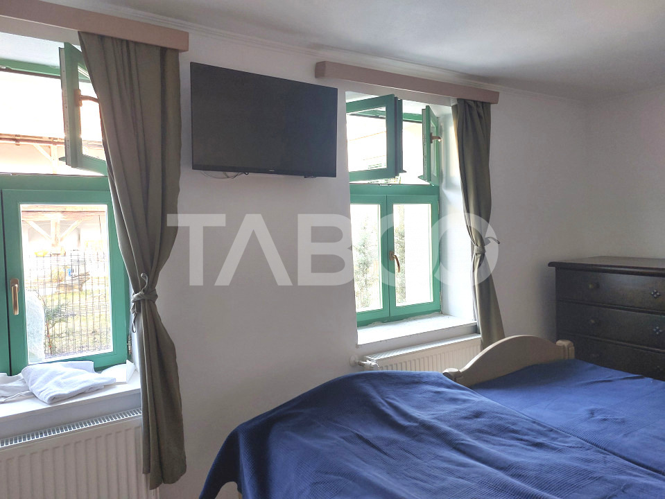 Apartament de vanzare 105 mp 3 camere curte 340 mp in acte Cisnadie